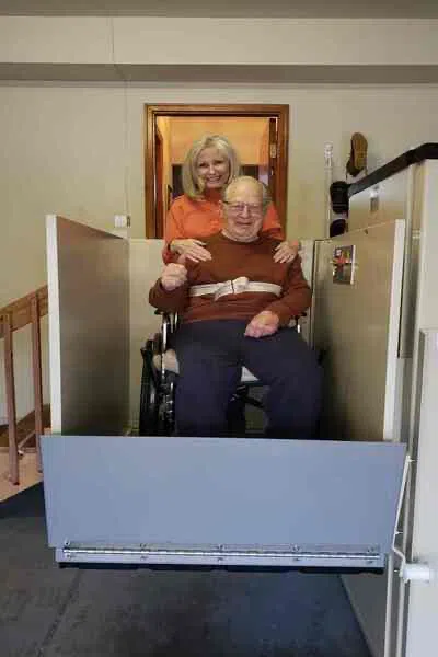 man-sitting-on-wheelchair-lift