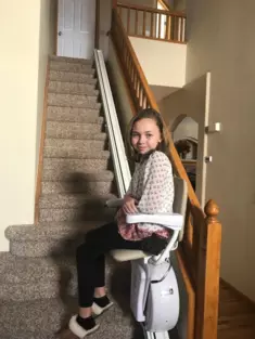 stair-lifts-with-a-girl-sitting